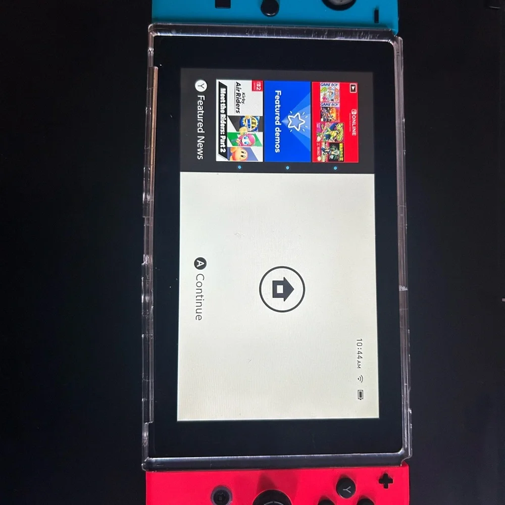 Nintendo Handheld Console with Red and Blue Controllers